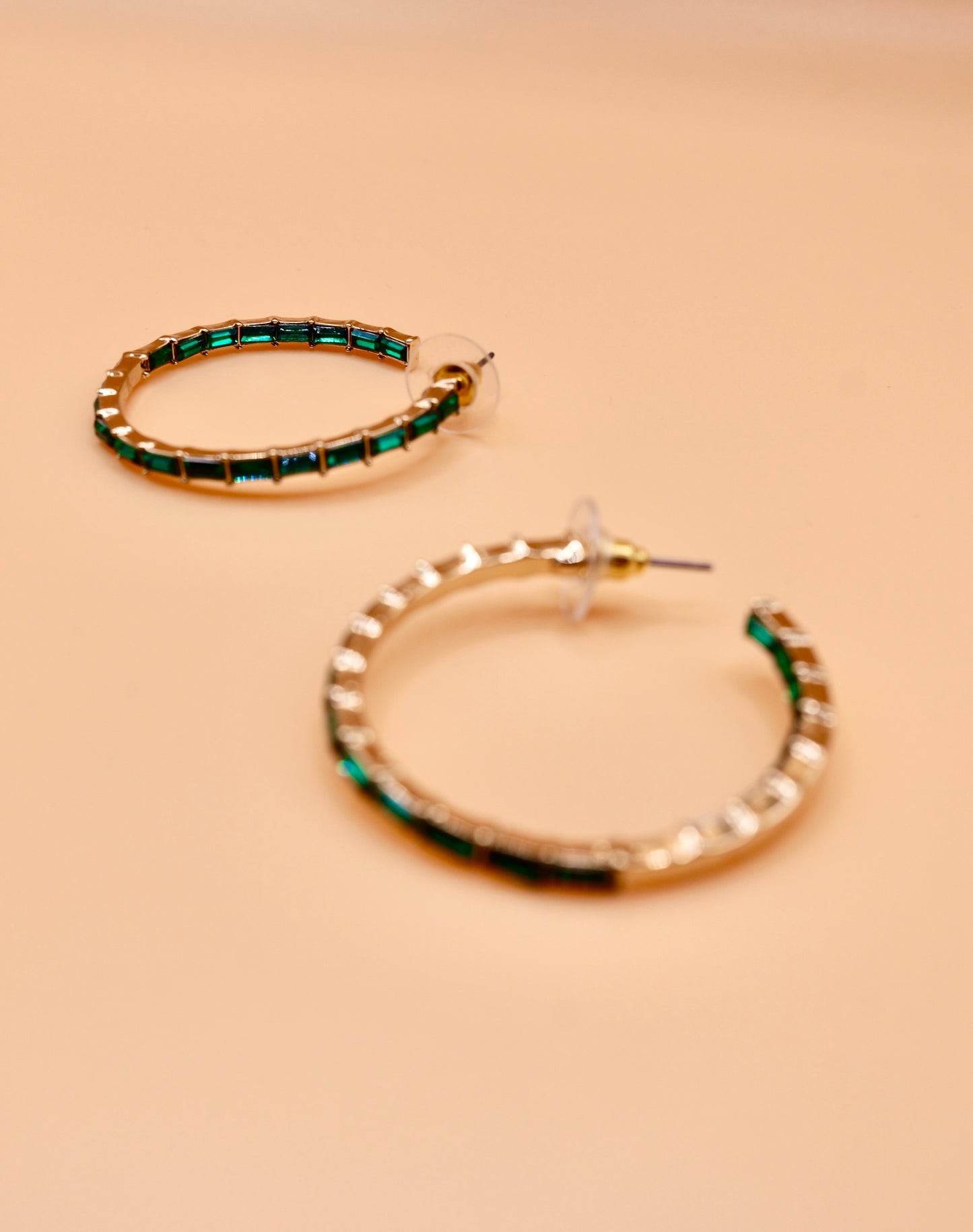 Green gem hoop earrings in gold