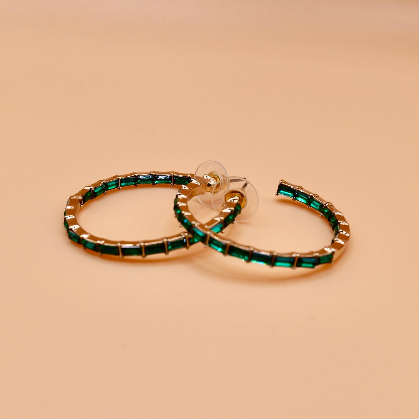 Green gem hoop earrings in gold