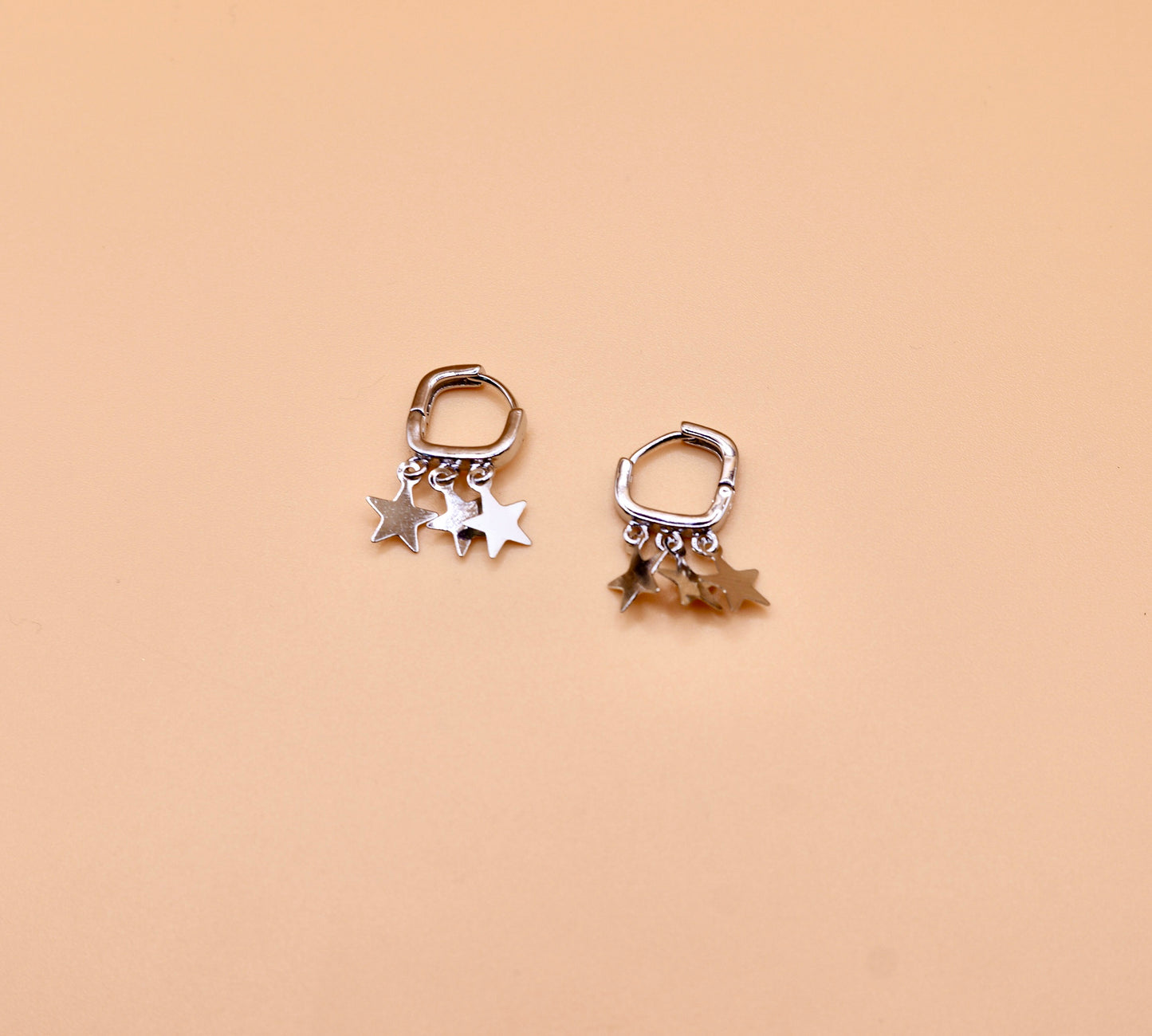 "Charlotte" Huggie star earrings in Silver