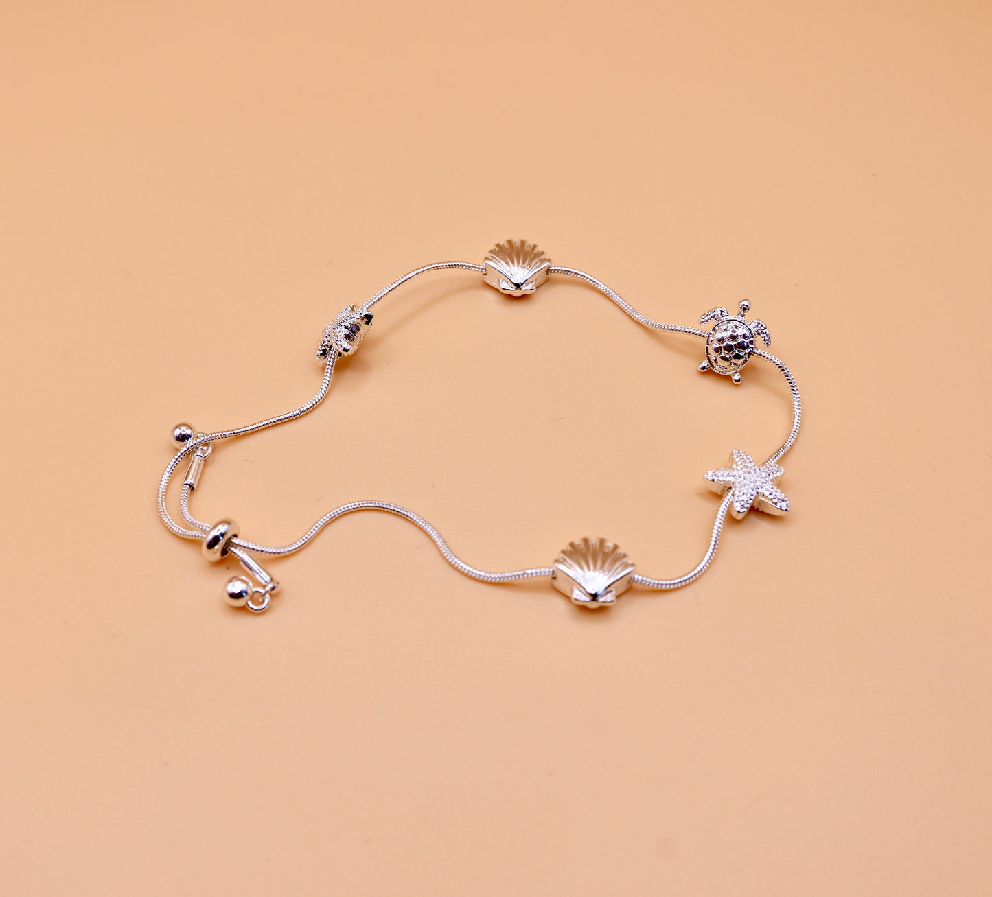 Shell gold charm bracelet in silver