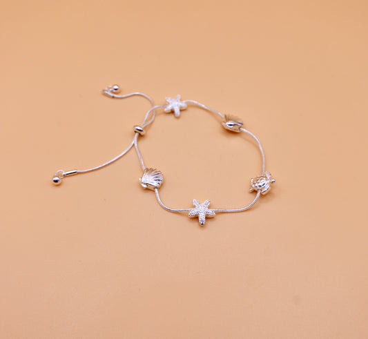 Shell gold charm bracelet in silver