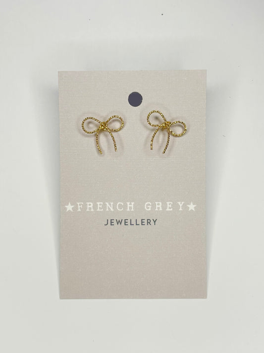 Mini bow stud earrings in gold