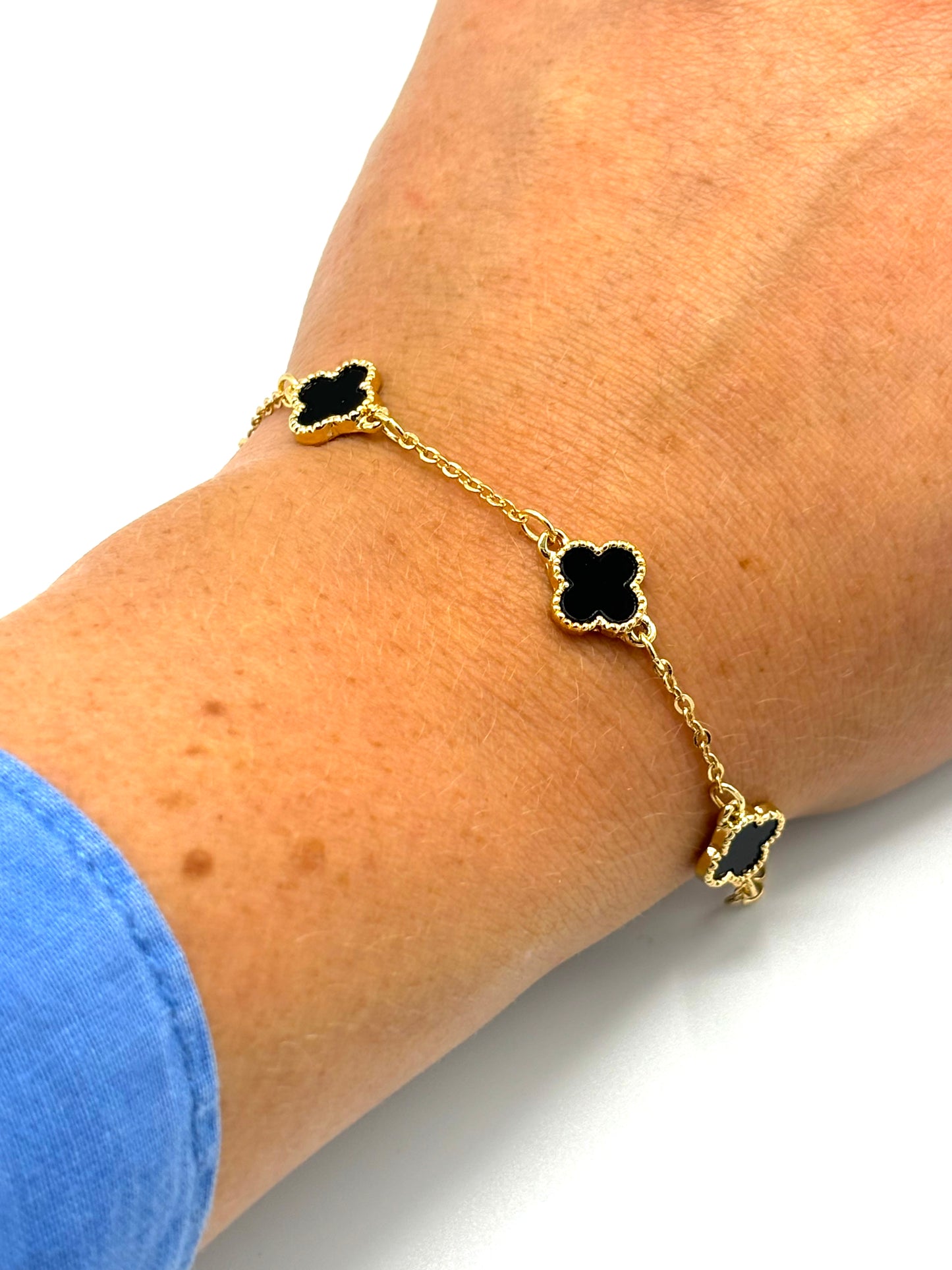 Clover black bracelet in gold