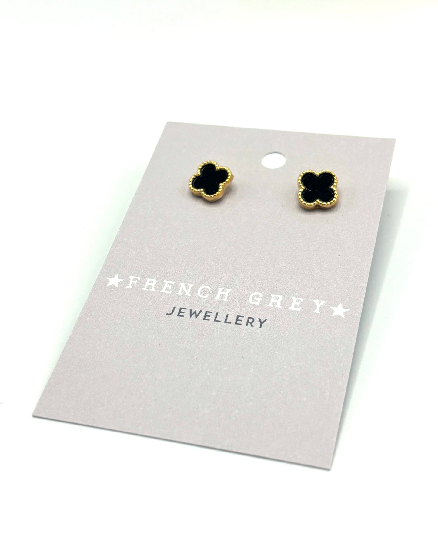 Clover stud earrings in gold and black