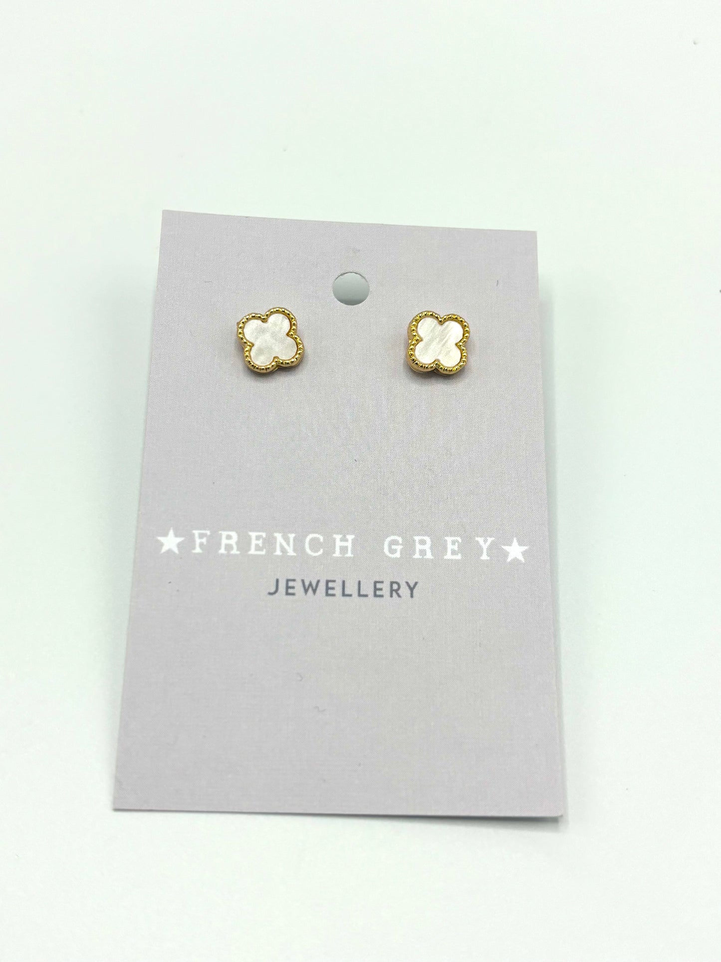 Clover stud earrings in gold and white