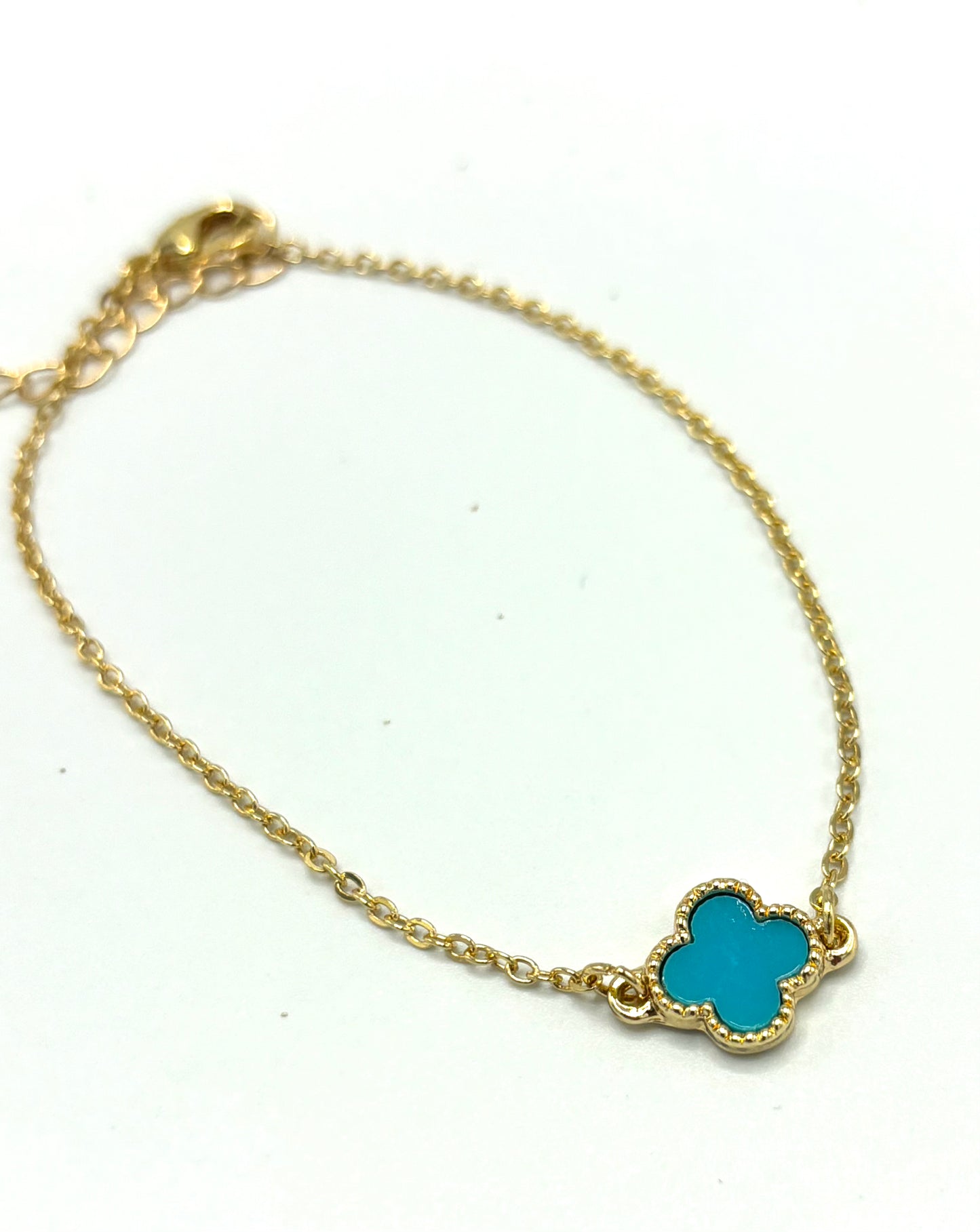 Single clover aqua bracelet in gold